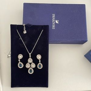 It’s a Swarovski diamond necklace with earrings.Navy blue colour,good condition.